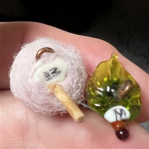 Two fun studio buttons by Mary Gaumond.