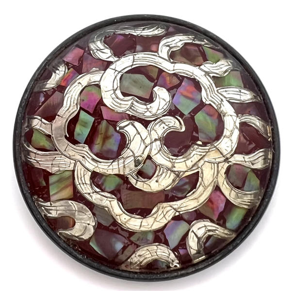 Extra large design under glass button of abalone chips and white metal.